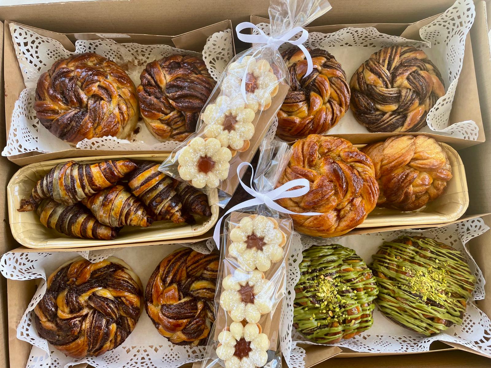 Assorted twists and cookies arranged in a wholesale pastry box